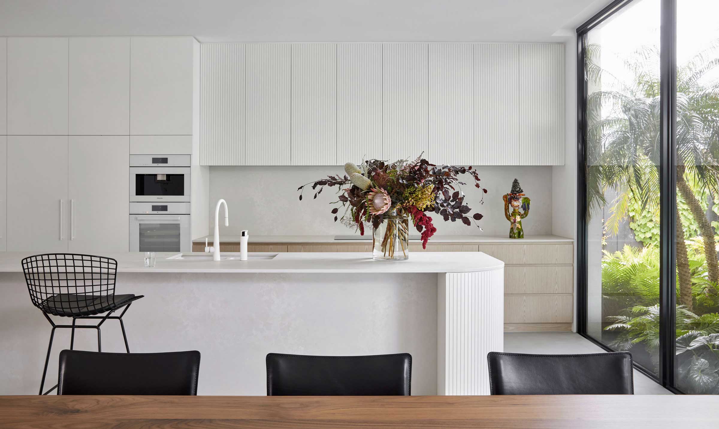 White kitchen with flower vase