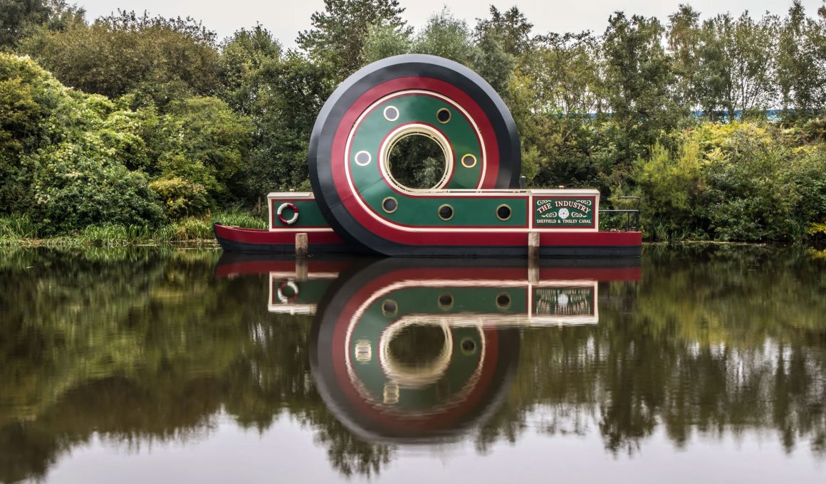 British Artist Alex Chinneck Unveils Whimsical Six-Metre Canal Boat Sculpture in Sheffield