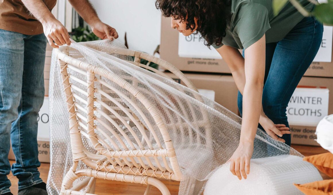 Couple packs a fragile chair with bubble wrap